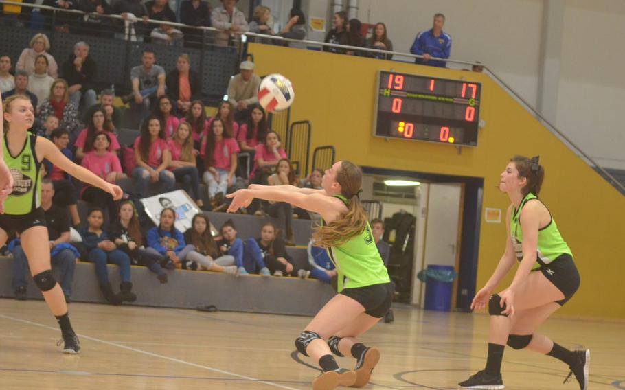 Olivia Sealey, an Alconbury junior, digs out a serve in the first game of the DODDS-Europe Division III volleyball championship match against Sigonella at Ramstein Air Base, Saturday, Nov. 7, 2015.