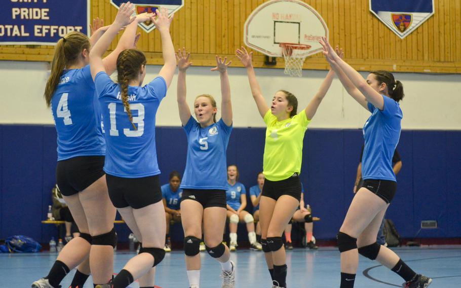 Members of the blue team celebrate after winning a point during the inaugural DODDS-Europe volleyball all star game Saturday, Nov. 14, 2015 at Ramstein Air Base, Germany. 