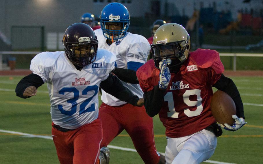 Keyshawn Green tries to get past Drew Pickney during the 2015 DODDS-Europe football all-star game held in Kaiserslautern, Germany, Saturday, Nov. 14, 2015.