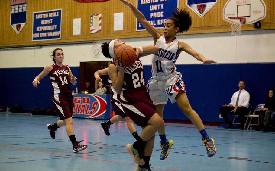 Ramstein Royal Desiree Palacios tries to block Vilseck Falcon Michaela Lewis during a game at Ramstein Air Base, Germany, on Friday, Dec. 4, 2015. The Royals defeated the visiting Falcons 53-16.