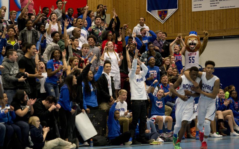 Fans cheer after the Ramstein Royals score during a game against the Vilseck Falcons at Ramstein Air Base, Germany, on Friday, Dec. 4, 2015.