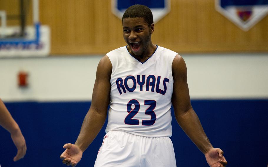 Ramstein Royal T.J. Williams celebrates after scoring two points at Ramstein Air Base, Germany, on Friday, Dec. 4, 2015. The Royals beat the visiting Vilseck Falcons 51-33.