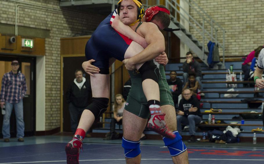 Alconbury's Nicholas Dufresne prepares to slam Lakenheath's Joseph Krussick during an exhibition bout Saturday at RAF Lakenheath, England. The meet pitted five schools against each other, but a low number of wrestlers led to officials pitting students in different weight classes against each other for practice.