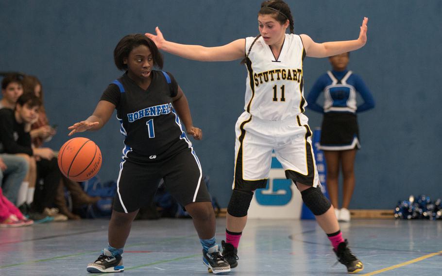 Tayah Curry scored 10 and was instrumental on defense for the Hohenfels Tigers during a during a cross-divisional DODDS-Europe basketball game at Hohenfels, Dec. 12, 2015. Here, Curry is defended by Panther Kat Farrar. 