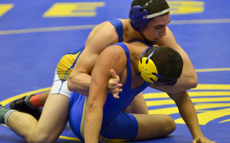 Gabriel Charlifue and Alec Pantoja, both of Wiesbaden, grapple in a 152-pound matchup Saturday at Wiesbaden High School. Charlifue won the weight class in the five-team meet, with teammate Pantoja taking fourth.