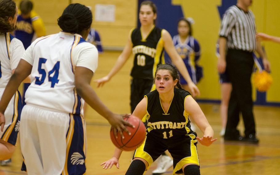 Stuttgart's Kat Farrar, right, defends against Wiesbaden's Kiana Sterns during a girls' varsity basketball game Friday, Feb. 5, 2016 in Wiesbaden, Germany. Stuttgart triumphed 45-10 off of a strong defensive effort.