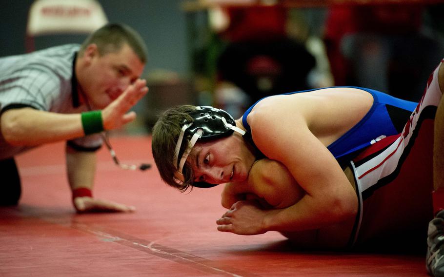 Hohenfels' Phillip Davis pins Kaiserslautern's John Lomeli during the DODDS-Europe Central Sectionals meet at Vogelweh, Germany, Saturday, Feb. 13, 2016.
