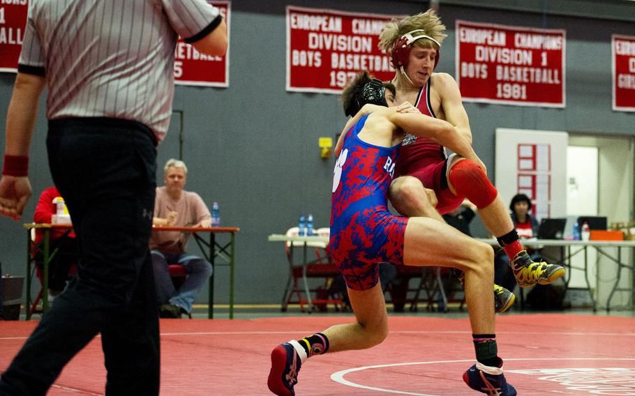 Ramstein's Ryan Ford takes down Kaiserslautern's Byron Wollaston during the DODDS-Europe Central Sectionals meet at Vogelweh, Germany, Saturday, Feb. 13, 2016.