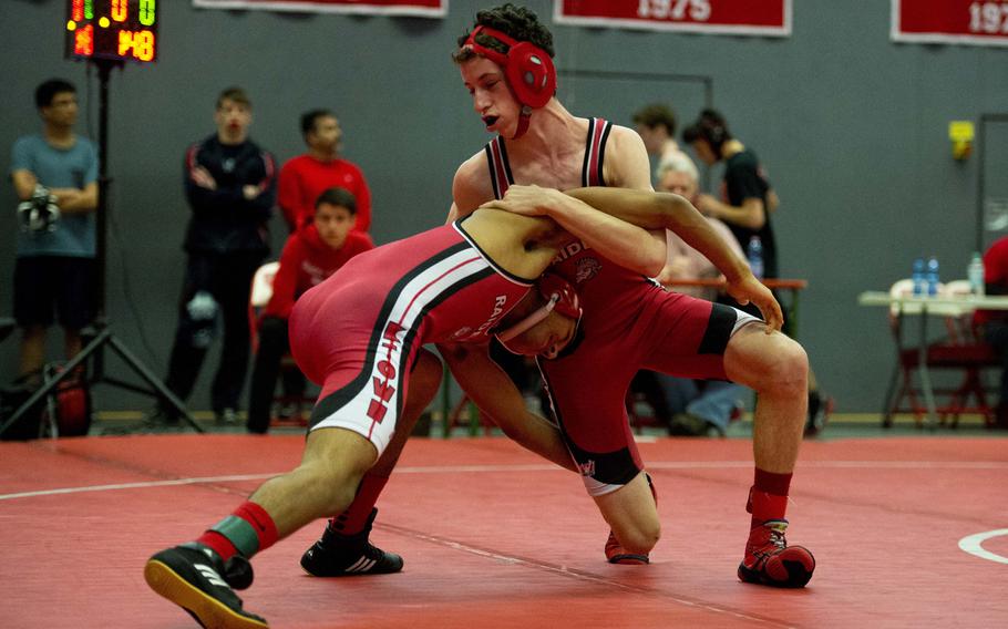 Paul Linehan and Victor Castro, both from Kaiserslautern, grapple during the DODDS-Europe Central Sectionals meet at Vogelweh, Germany, Saturday, Feb. 13, 2016. 