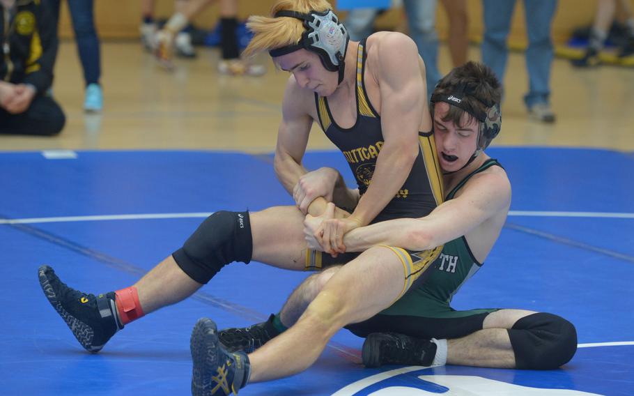 AFNORTH's CJ Kolosky drags down Stuttgart's Connor Fortier in a 132-pound match in opening-day action at the DODDS-Europe wrestling championships in Wiesbaden, Germany, Friday, Feb. 19, 2016. Fortier went on to win the first-round match.