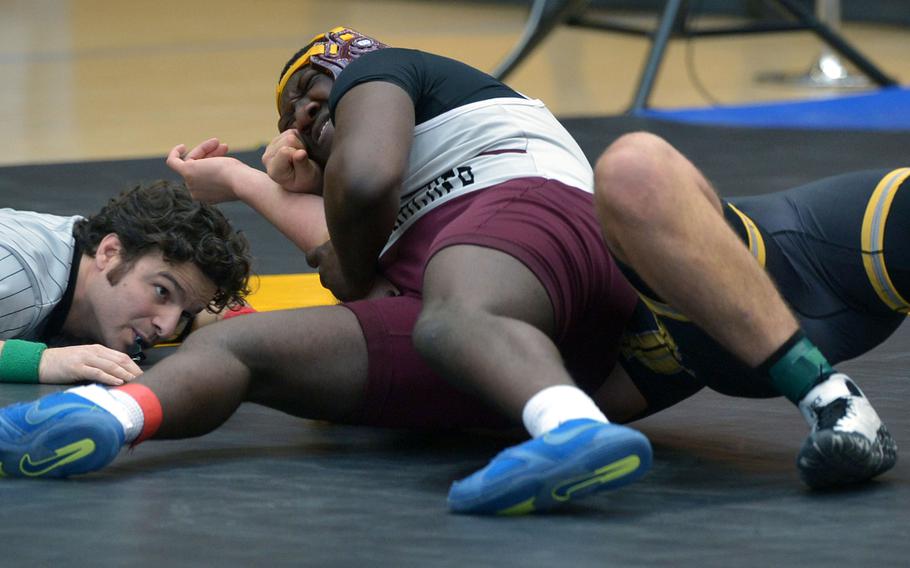 Baumholder's Yorel Smalls puts the pressure on Stuttgart's Michael Stuber on his way to winning the 195-pound match on opening day of the DODDS-Europe wrestling championships in Wiesbaden, Germany, Friday, Feb. 19, 2016.