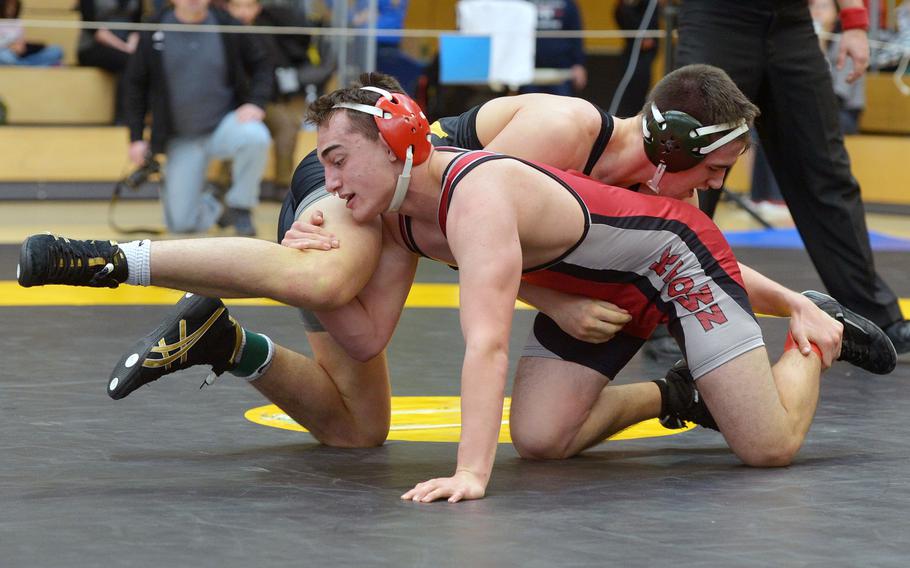 Kaiserslautern's Zach Greene, front, and Vicenza's Seth Shields try to get the advantage over each other in a 170-pound match in opening-day action at the DODDS-Europe wrestling championships in Wiesbaden, Germany, Friday, Feb. 19, 2016. Shields went on to win.