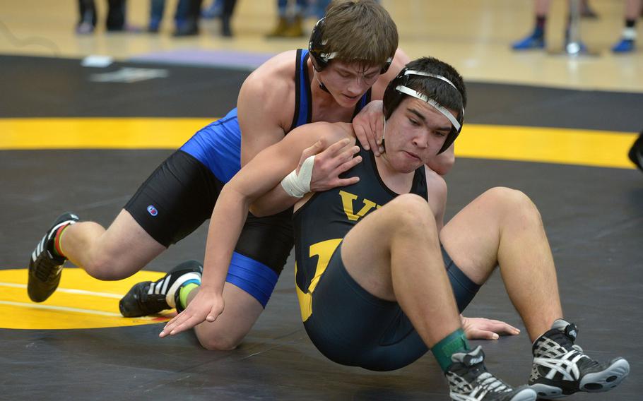 Hohenfels' Phillip Davis, left, grapples with Vicenza's Ethan Johnston in a 170-pound match in opening-day action at the DODDS-Europe wrestling championships in Wiesbaden, Germany, Friday, Feb. 19, 2016. Johnston got out of Davis' grip and went on to win the match.