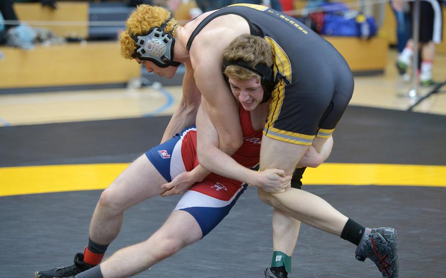 Aviano's Ayden Capps, left, tries to pressure Stuttgart's Thomas Bernard in a 160-pound match in opening-day action at the DODDS-Europe wrestling championships in Wiesbaden, Germany, Friday, Feb. 19, 2016. Bernard went on to win.