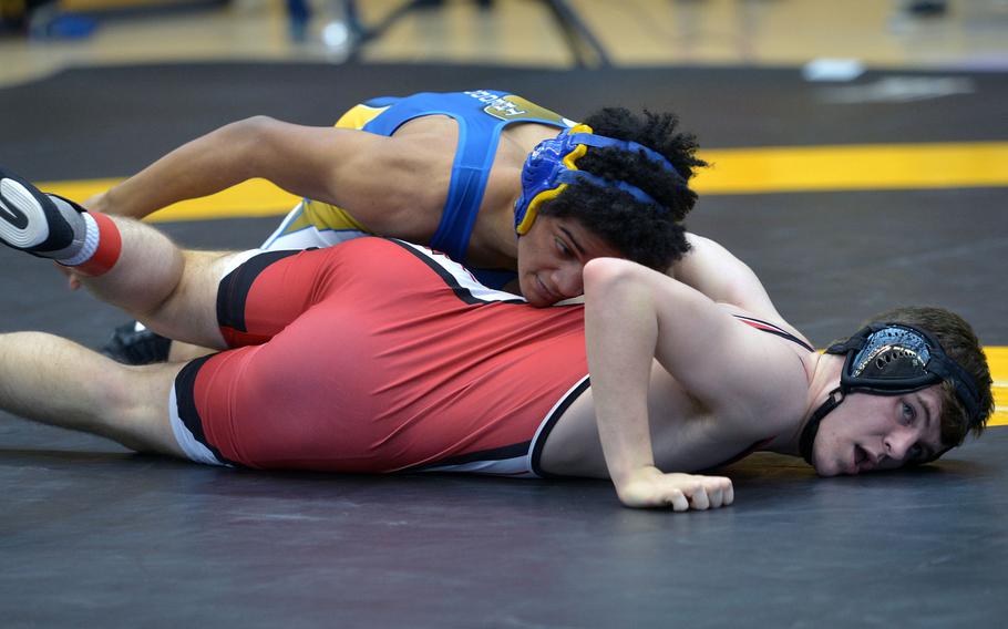 Wiesbaden's Joshua Theodore, left, tries to turn Kaiserslautern's Parker Rose in a 145-pound match in opening-day action at the DODDS-Europe wrestling championships in Wiesbaden, Germany, Friday, Feb. 19, 2016. Theodore won.