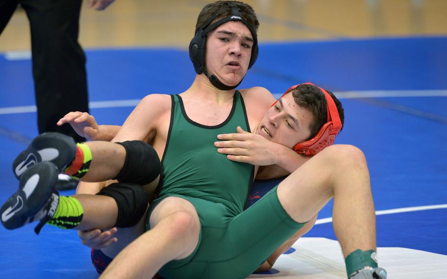 Seamus Wade of Naples, front, gets the better of Lakenheath's Malik Shoemaker in a 138-pound match in opening-day action at the DODDS-Europe wrestling championships in Wiesbaden, Germany, Friday, Feb. 19, 2016. Wade won the match.