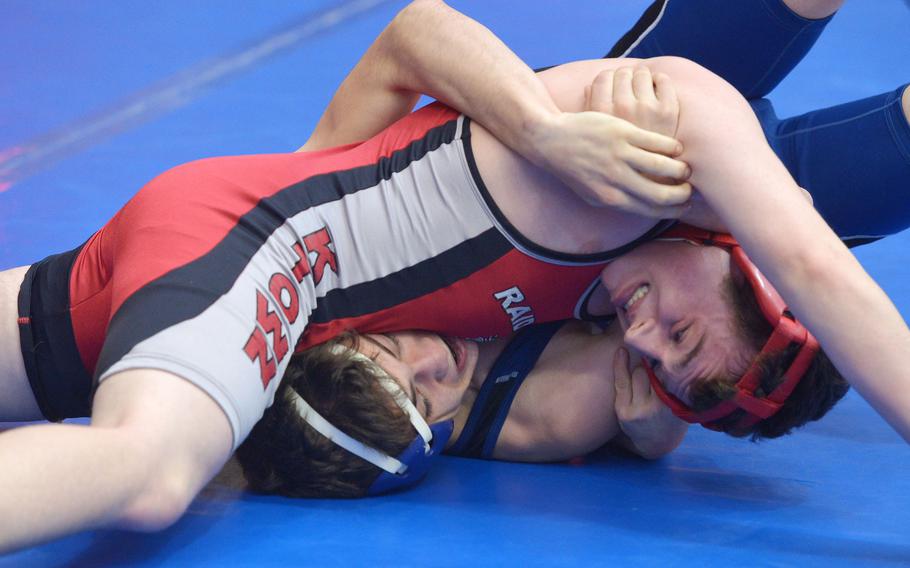 Kaiserslautern's Ian Rowell puts the pressure on Rota's Presley Peters in a 138-pound match. Peters got out of the jam and went on to win in opening-day action at the DODDS-Europe wrestling championships in Wiesbaden, Germany, Friday, Feb. 19, 2016.