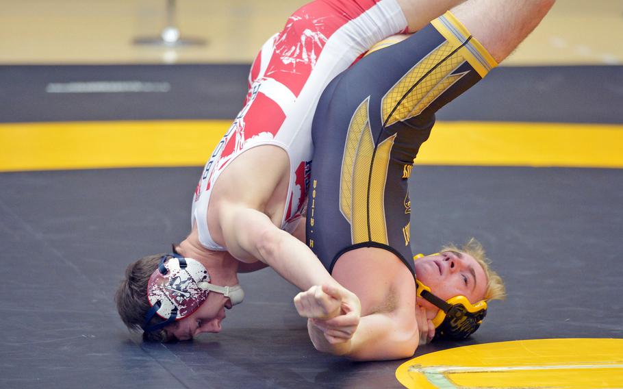 Lakenheath's Preston Booth, left, and Stuttgart's Harrison Alton grapple in a 132-pound match in first-round action on opening day of the DODDS-Europe wrestling championships in Wiesbaden, Germany, Friday, Feb. 19, 2016. Booth won the match.