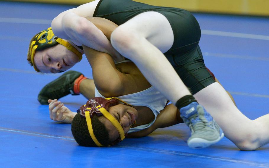 In a 113-pound match Vicenza's Clay Cashman, top, defeated Baumholder's Marvin Crews in the first day of action at the DODDS-Europe wrestling championships in Wiesbaden, Germany, Friday, Feb. 19, 2016.