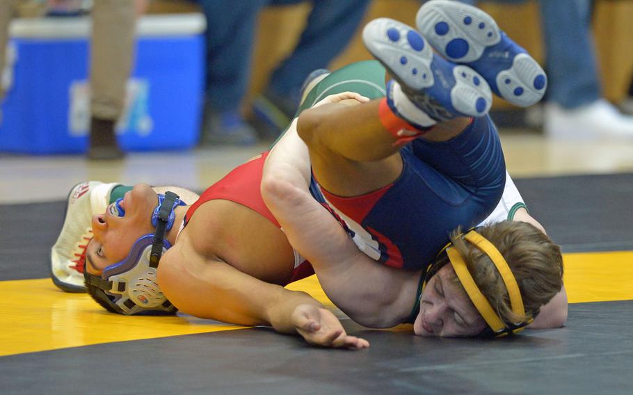 Alcoconbury's Joey Wood, right, beat Bitburg's Henry Etheridge in a 105-pound match in first-day action at the DODDS-Europe wrestling championships in Wiesbaden, Germany, Friday, Feb. 19, 2016.