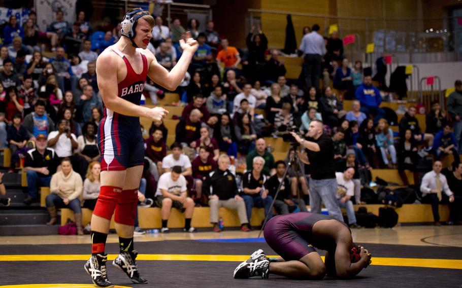 Bitburg's John Blake celebrates after defeating Vilseck's Jermel Perry during the DODDS-Europe wrestling championship at Clay Kaserne, Germany, on Saturday, Feb. 20, 2016. Blake won the 182-pound weight class by pinning Perry in one minute, 11 seconds.