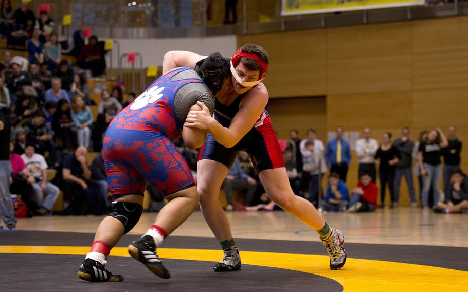 Lakenheath's Colten Menges, right, and Ramstein's Erik Gerena grapple during the DODDS-Europe wrestling championship at Clay Kaserne, Germany, on Saturday, Feb. 20, 2016. Menges won the 285-pound weight class with a 2-1 victory over Gerena in overtime.