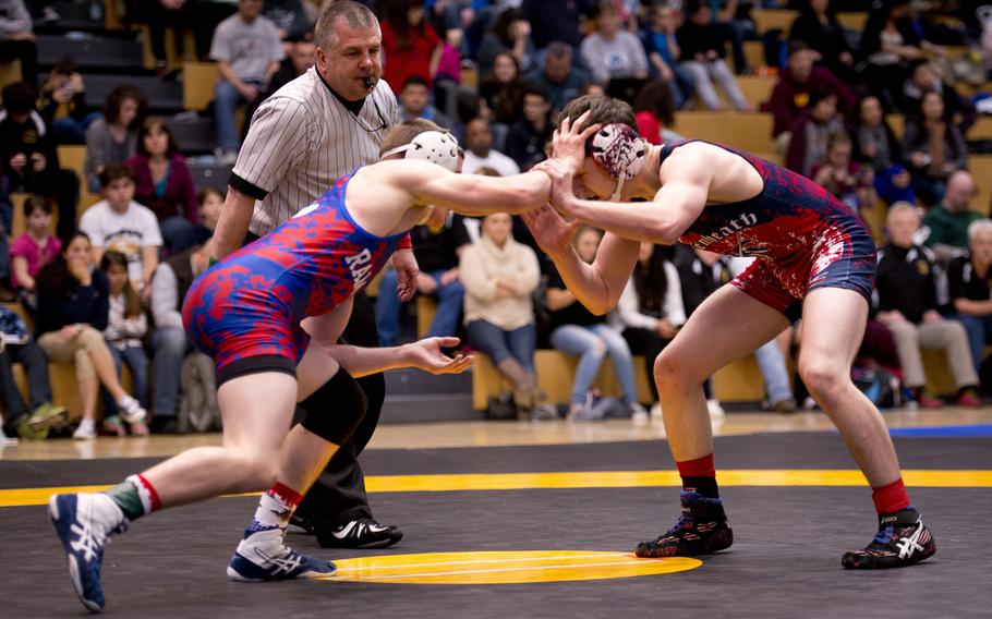 Ramstein's Joey Fortunato tries to fend off Lakenheath's Preston Booth during the DODDS-Europe wrestling championship at Clay Kaserne, Germany, on Saturday, Feb. 20, 2016. Fortunato beat Booth 8-3 to win the 132-pound weight class.