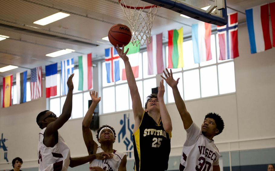 Stuttgart's Daniel Wetlesen goes for a layup past several Vilseck defenders during opening day of the DODDS-Europe basketball championships at Vogelweh, Germany, Wednesday, Feb. 24, 2016. Stuttgart won the Division I game 59-44.