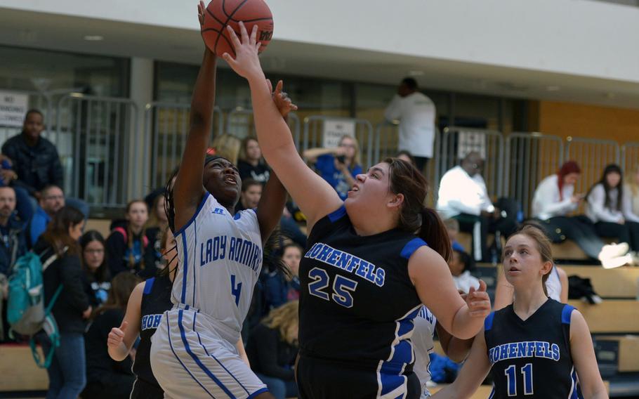 Rota's Shardasia Wilson goes to the basket against Hohenfels' Siera Standifer  in opening-day Division II action at the DODDS-Europe basketball championships in Wiesbaden, Germany, Wednesday, Feb. 24, 2016. Rota won the game 26-23.