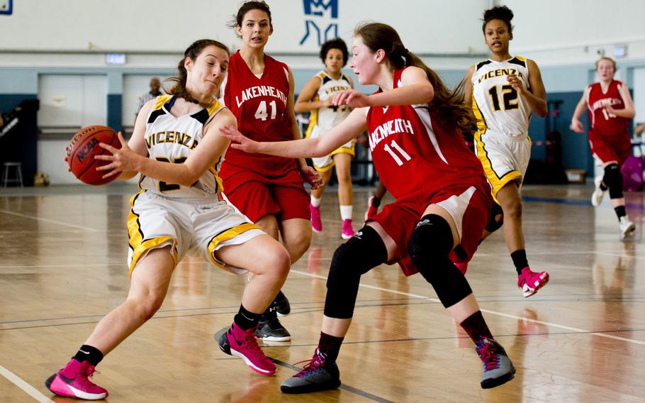 Vicenza's Emma Knapp tries to cut past Lakenheath's Lilli Estus on day two of the DODDS-Europe basketball championships at Vogelweh, Germany, Wednesday, Feb. 25, 2016. Vicenza won 45-28 and advances to the semifinals.