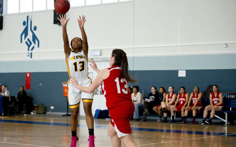Vicenza's DeAsia Fairley shoots over Lakenheath's Daija Lindquist on day two of the DODDS-Europe basketball championships at Vogelweh, Germany, Wednesday, Feb. 25, 2016. Vicenza won 45-28 and advances to the semifinals.
