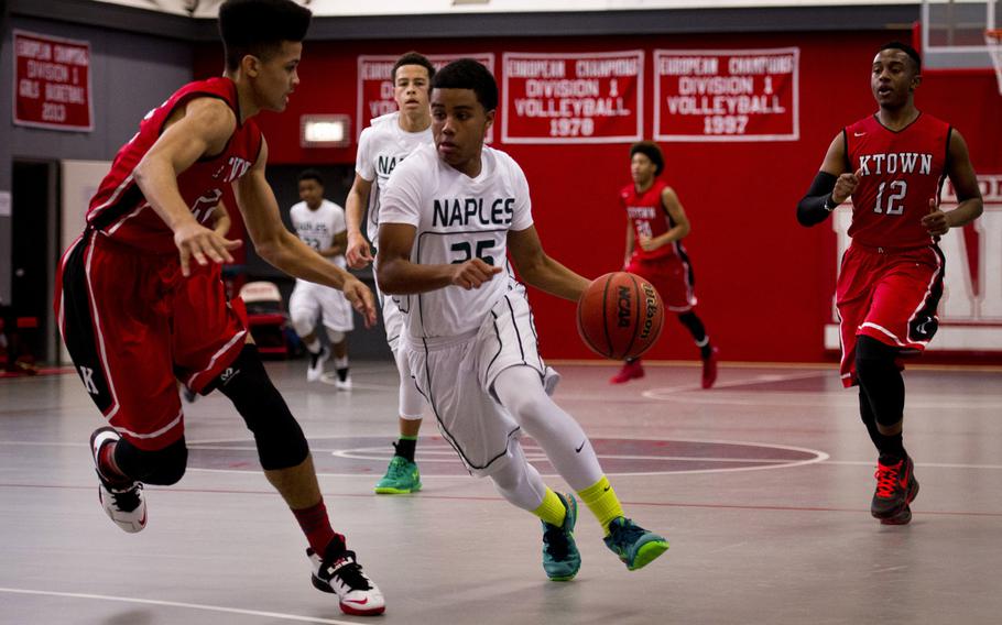 Naples' Terrell Staten tries to dribble around Kaiserslautern's Markell Johnson on day two of the DODDS-Europe basketball championships at Vogelweh, Germany, Wednesday, Feb. 25, 2016. Kaiserslautern won the Division I game 42-38.