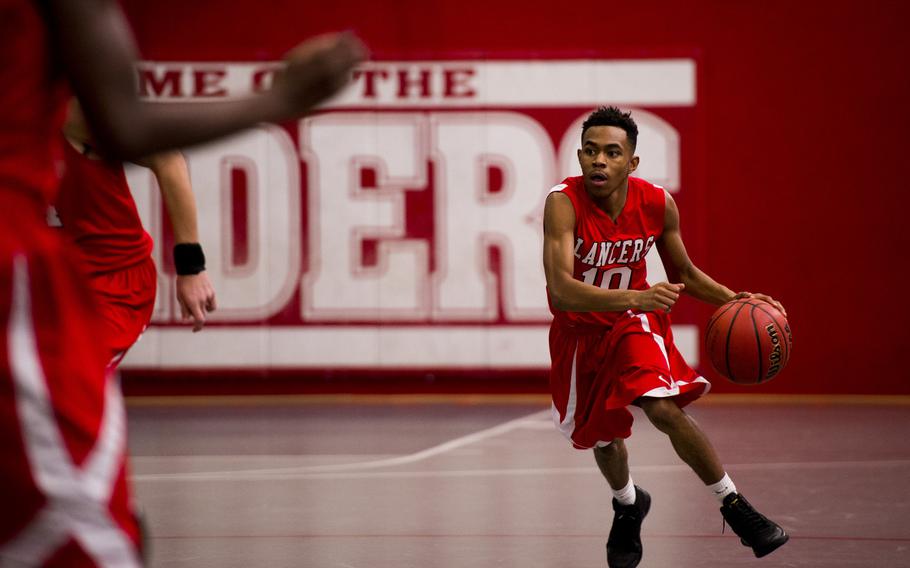 Lakenheath's Kentavious Seawood dribbles down the court during a Division I game against Vilseck on day two of the DODDS-Europe basketball championships at Vogelweh, Germany, Wednesday, Feb. 25, 2016.