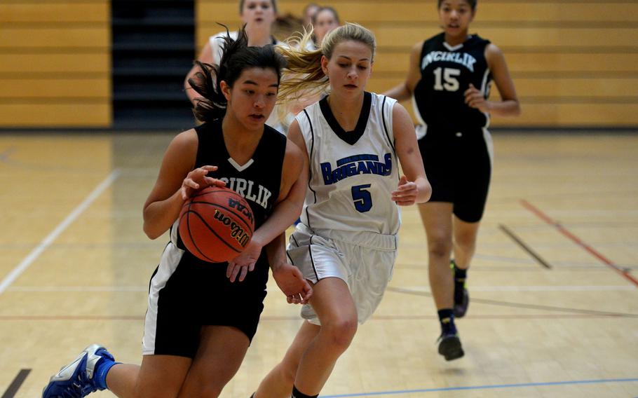 Incirlik's Maja Inthavay drives to the basket against Brussels' Maria Vahrenhorst  in a Division III game at the DODDS-Europe basketball championships in Wiesbaden, Germany, Thursday, Feb. 25, 2016. Incirlik defeated Brussels 15-8.