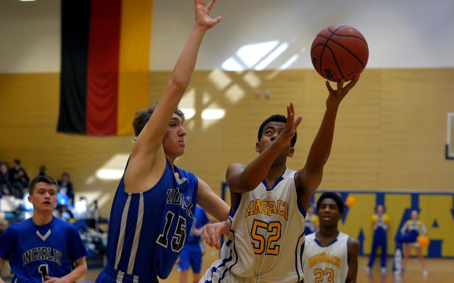 Ansbach's Jordan Flowers attempts a shot past Incirlik's Sam Galbreath in a Division III game at the DODDS-Europe basketball championships in Wiesbaden, Germany, Thursday, Feb. 25, 2016.Top-seeded Ansbach beat Incirlik 69-46. 