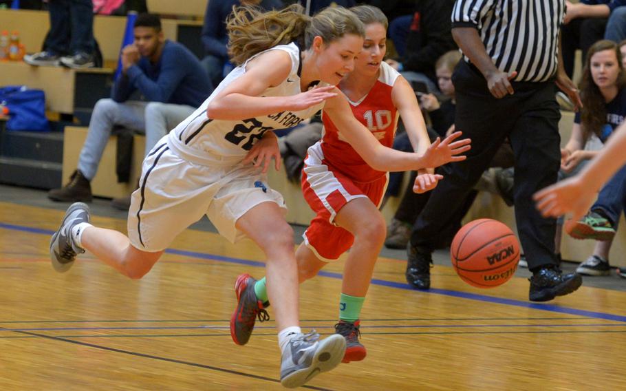 Black Forest Academy's Anna Kragt, left, battles for the ball with American Overseas School of Rome's Alessia Gionbini in a girls Division II semifinal at the DODDS-Europe basketball championships in Wiesbaden, Germany, Friday, Feb. 26, 2016. BFA won 50-17 to advance to Saturday's final against Bitburg, a rematch of last year's title game.