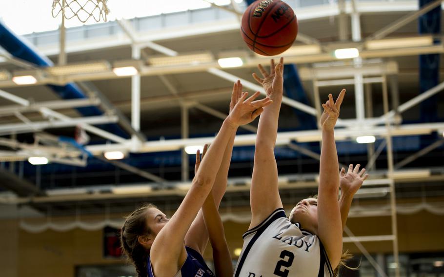 Bitburg's Alexa Landenberger shoots over Bahrain's Zoie Howes during a DODDS-Europe Division II semifinal game at Clay Kaserne, Germany, Friday, Feb. 26, 2016. Bitburg beat Bahrain 42-16. 