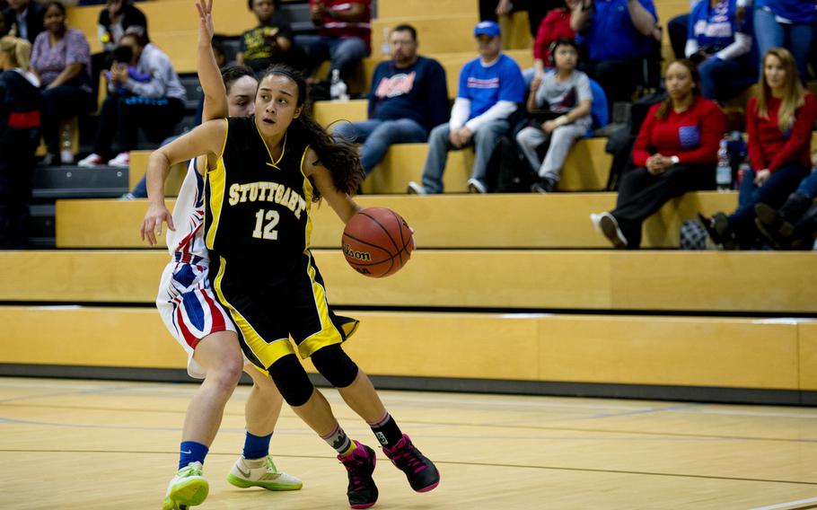 Stuttgart's Marissa Encarnacion dribbles around Ramstein's Ebony Madrid during a DODDS-Europe Division I semifinal game at Clay Kaserne, Germany, Friday, Feb. 26, 2016. Ramstein won the game 31-30. 