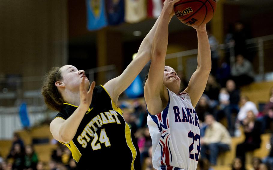 Ramstein's Ebony Madrid gets a rebound over Stuttgart's Abby Zipperer during a DODDS-Europe Division I semifinal game at Clay Kaserne, Germany, Friday, Feb. 26, 2016. Ramstein defeated Stuttgart 31-30. 