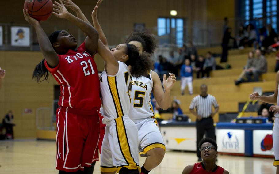 Kaiserslautern's Le'Jhanique Brown shoots over Vicenza's Altasia Thompson during a DODDS-Europe Division I semifinal game at Clay Kaserne, Germany, Friday, Feb. 26, 2016. Vicenza won 46-29. 