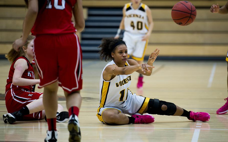 Vicenza's Altasia Thompson passes the ball during a DODDS-Europe Division I semifinal game against Kaiserslautern at Clay Kaserne, Germany, Friday, Feb. 26, 2016. Vicenza won the game 46-29. 