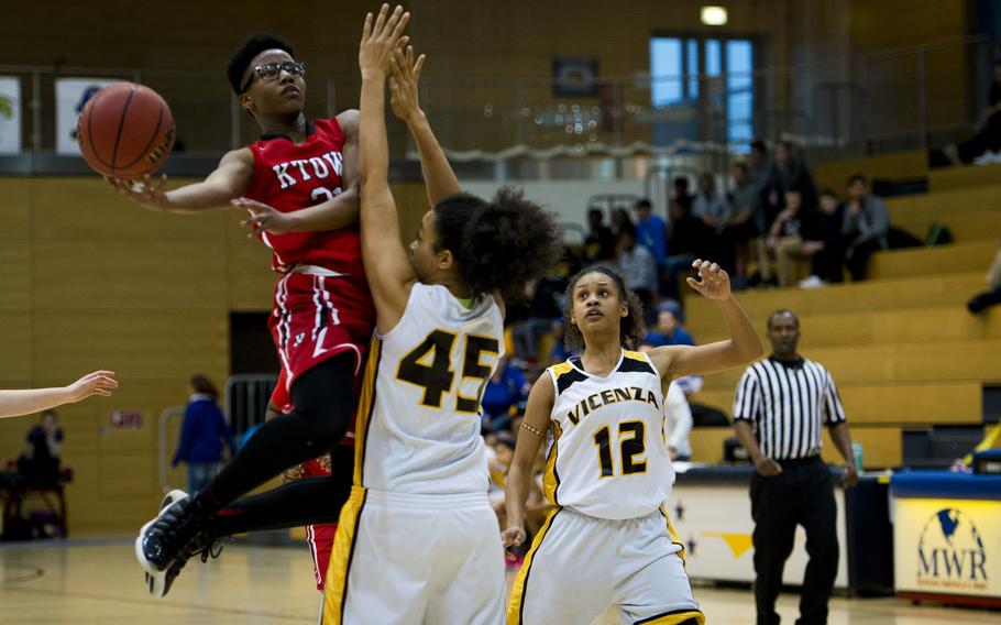 Kaiserslautern's Byanca Powell shoots over Vicenza's Aerial Rouse during a DODDS-Europe Division I semifinal game at Clay Kaserne, Germany, Friday, Feb. 26, 2016. Vicenza won 46-29. 