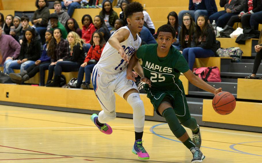 Naples' Terell Staten drives to the basket against Ramstein's D'Angelo Griggs in a Division I semifinal at the DODDS-Europe basketball championships in WIesbaden, Germany. Friday, Feb. 26, 2016. Ramstein won 60-41 to advance to Saturday's final against Kaiserslautern.
