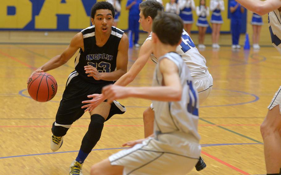 Incirlik's Jermaine Eggleston drives to the basket against Brussels' Ajaz Urbanc  in a Division III game at the DODDS-Europe basketball championships in Wiesbaden, Germany, Friday, Feb. 26, 2016. Incirlik won the game.
