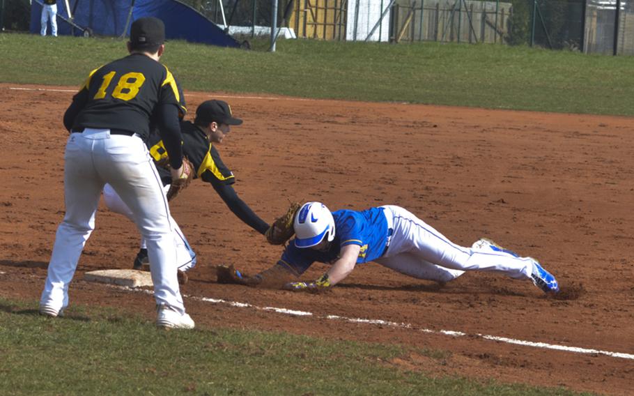 Kohl Kraus of Stuttgart applies a tag to R Wilton of Wiesbaden during a baseball game between Wiesbaden and Stuttgart, Saturday, March 26, 2016 at Clay Kaserne in Wiesbaden. Host Wiesbaden took both games of a doubleheader, coming from behind each time.