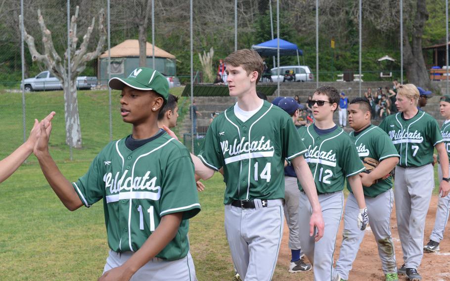 The Naples Wildcats baseball team files past the Aviano Saints after their 14-3 win during opening day of play in the 2016 DODEA-Europe season in Naples on Friday, April 1, 2016.