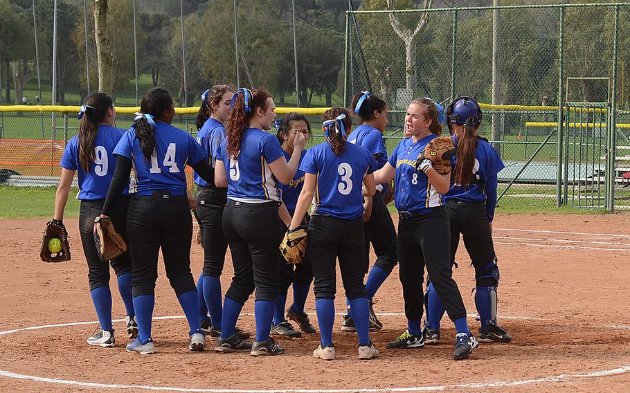 The Sigonella Jaguars softball team gathers on the mound during its game against Aviano in Naples, Italy, on Saturday, April 2, 2016. 