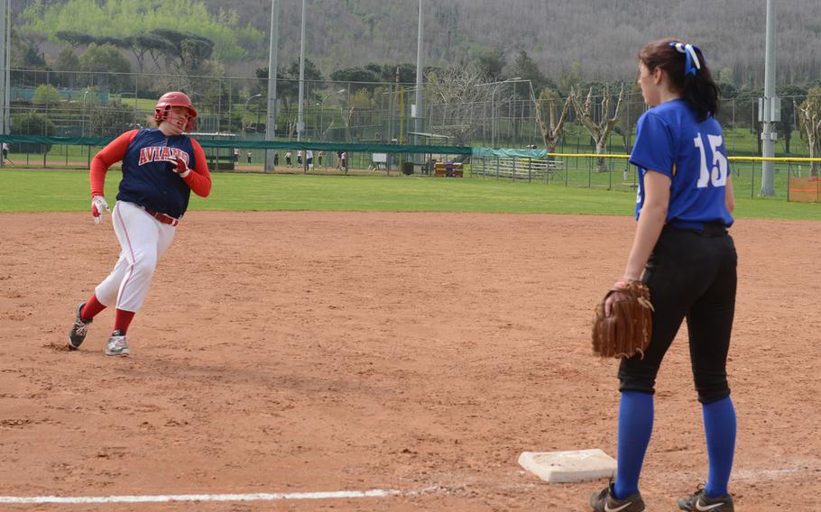 Aviano junior Mackenzie Milligan heads toward third base during a softball game against Sigonella in Naples, Italy, on Saturday, April 2, 2016. 