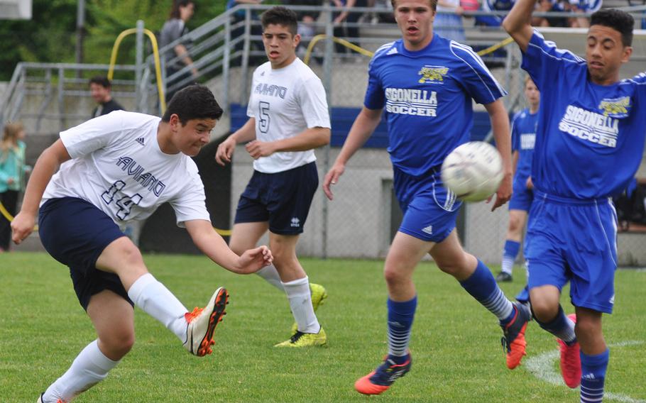 Aviano's Alex Munoz Nuno launches the ball past Sigonella defenders in the Saints' 4-0 victory over the Jaguars on Friday.