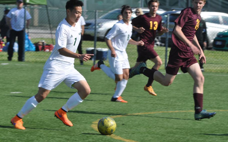 Naples' Jin Pak moves the ball upfield Friday in the Wildcats' 3-0 victory over Vilseck in Vicenza, Italy.